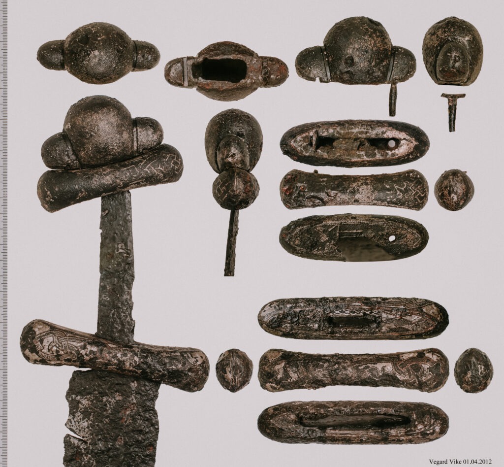 Viking Age grave find from Gjermundbu (farm no. 105, property no. 1), Haug parish, Norderhov parish district, Buskerud. Grave I. The find was reported to the University’s Oldsaksamling (Collection of Antiquities) on 30 March 1943. Curator Sverre Marstrander and assistant Charlotte Thomas were immediately sent to the site. On the basis of Marstrander’s report of 17 April 1943, the following may be stated: The find was made during the excavation of a mound. The Gjermbu or Gjermundbu farms are situated high in the hills at the upper end of Haugsbygd, with extensive views over the Ringerike plain and westward towards the mountains of Telemark.